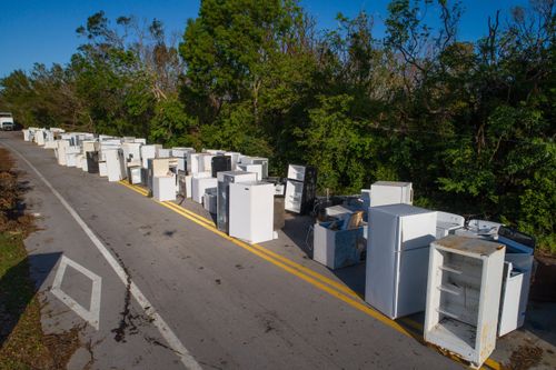 street lined with old appliances waiting for pickup
